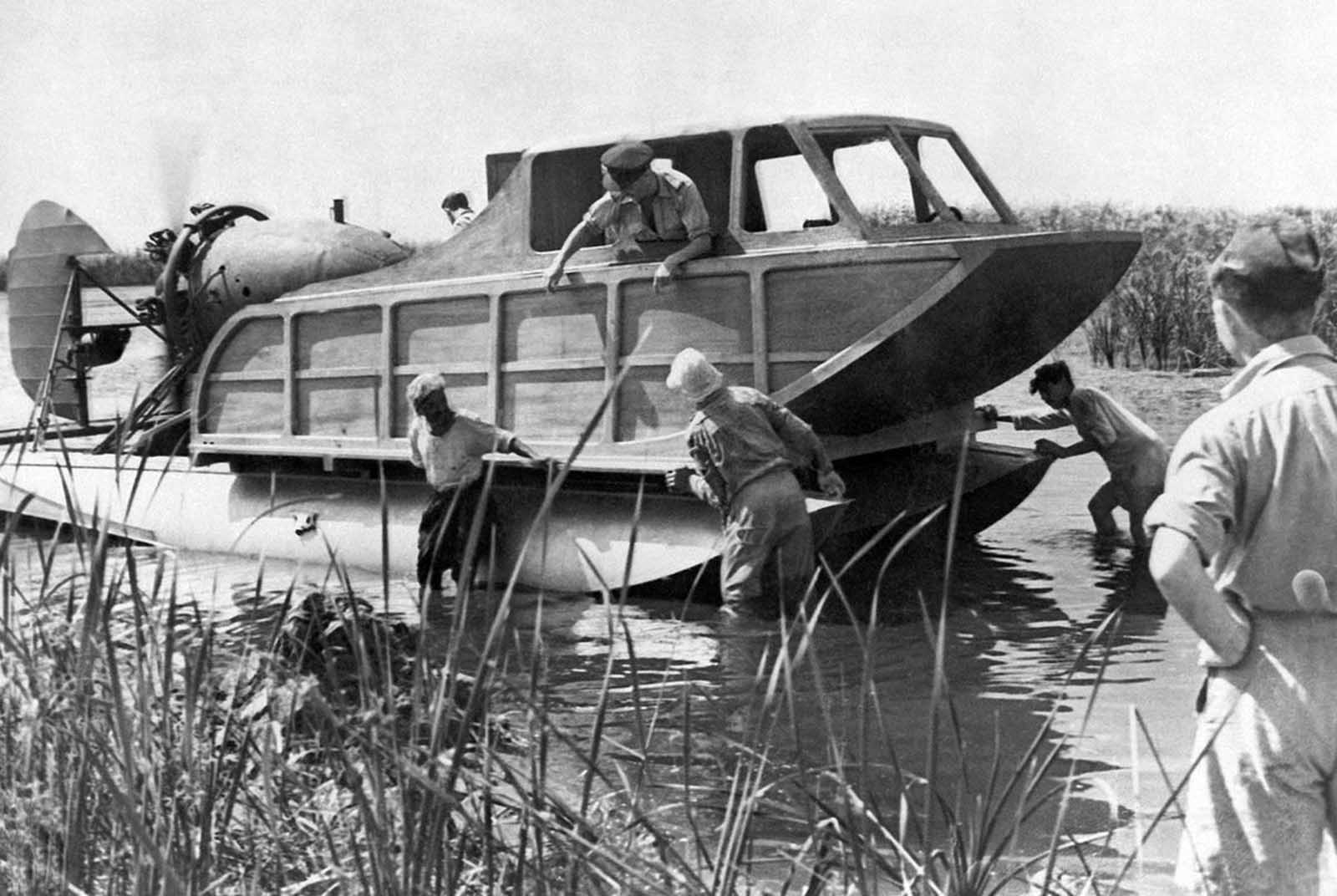 This hydroplane is part of the R.A.F. rescue service in the Middle East. It operates on the lakes of the Nile Delta for the assistance of pilots who may make forced landings in the water. Consisting of a cabin mounted on seaplane flats it is driven by an aircraft engine and propeller mounted in the stern and steered by an aircraft rudder. There are also rudders on each of the floats. The top speed of the craft is about fifteen knots. Photo taken on March 11, 1942. 