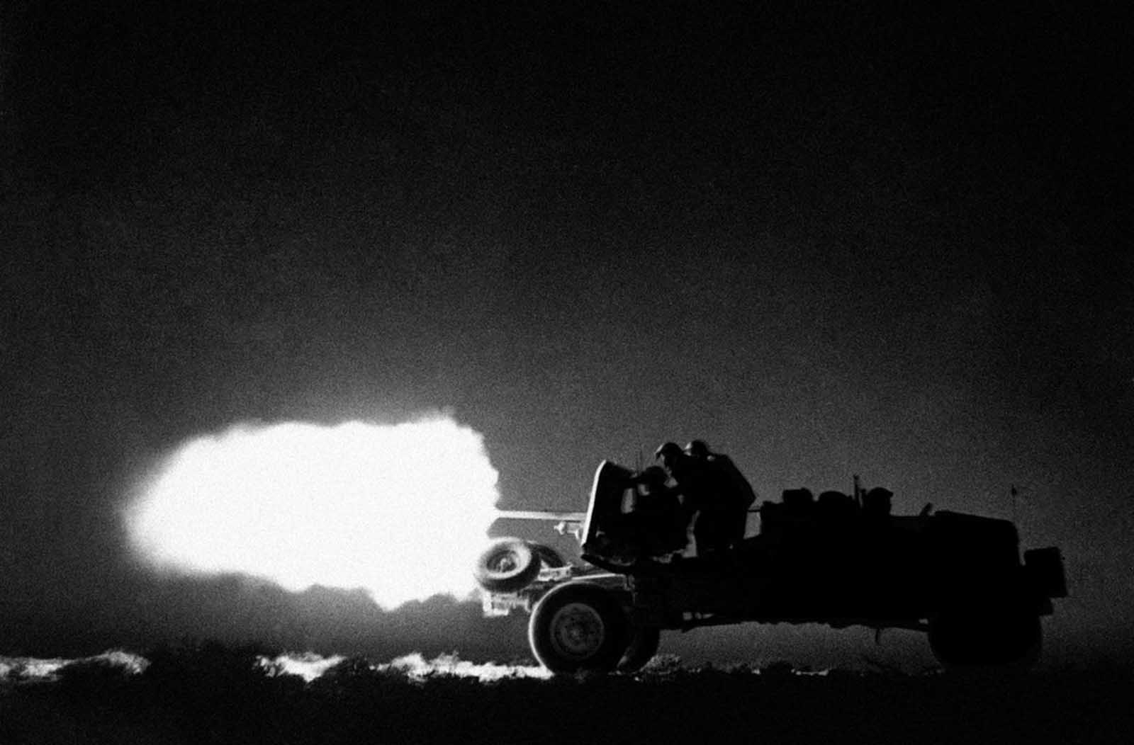 Truck-mounted anti-tank guns, used as highly mobile, hard-hitting artillery units, speed over the desert and attack the enemy from all sorts of unexpected quarters. A mobile anti-tank unit of the Eighth Army in action, somewhere in the desert, Libya, on July 26, 1942.