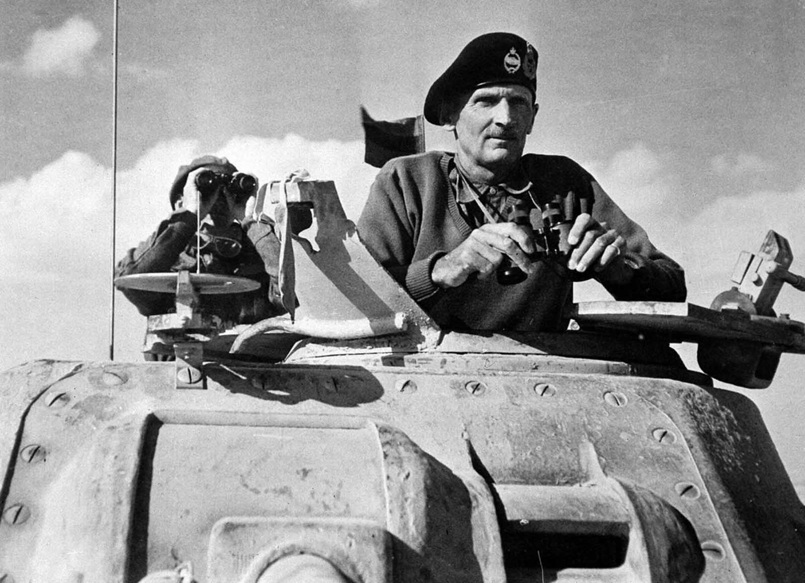 Britain's General Bernard Montgomery, Commander of the Eighth Army, watches battle in Egypt's Western Desert, from the turret of an M3 Grant tank, in 1942.
