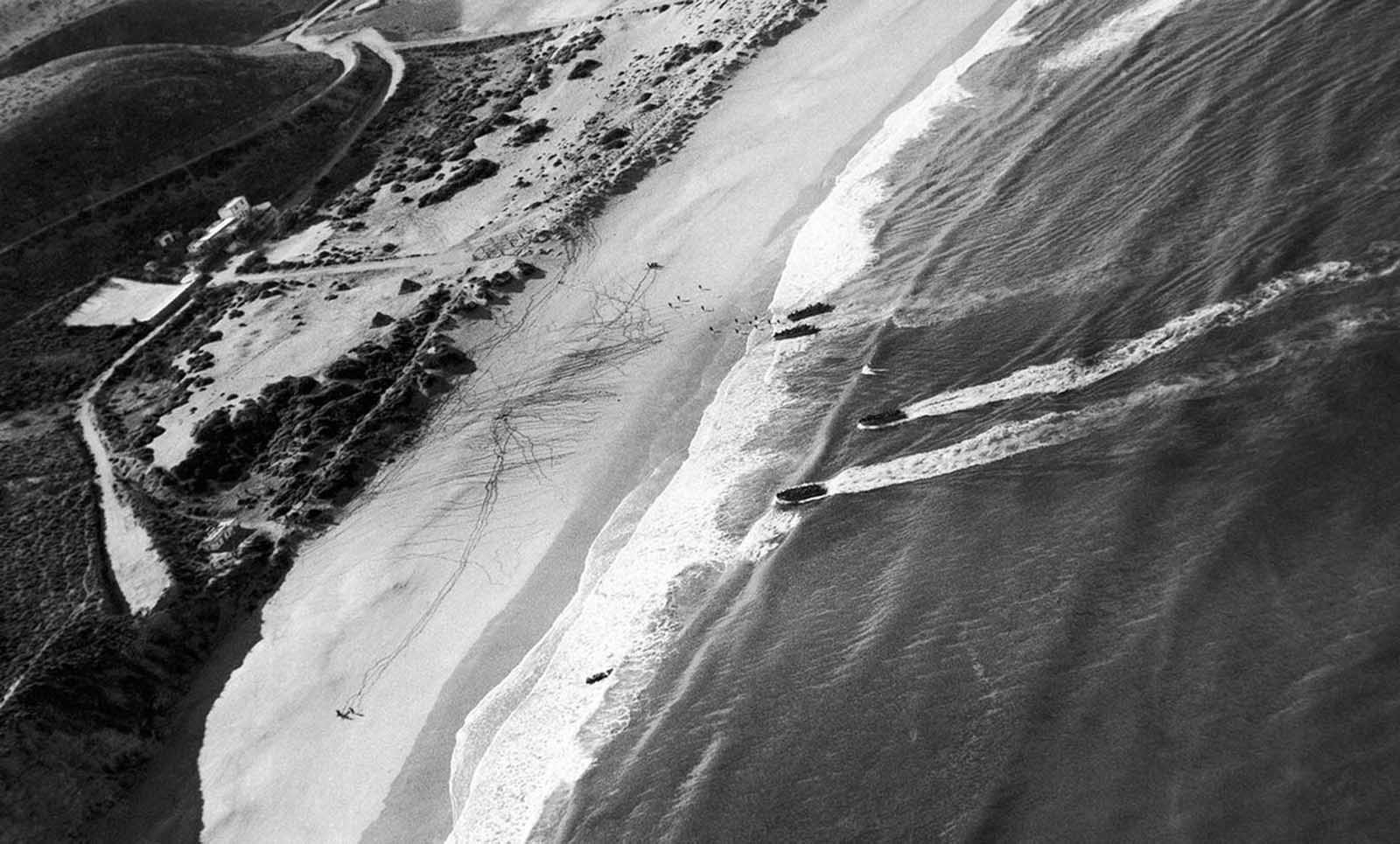 Allied troops land and follow the spider webs of footprints left by first parties near Casablanca, French Morocco, in November of 1942.