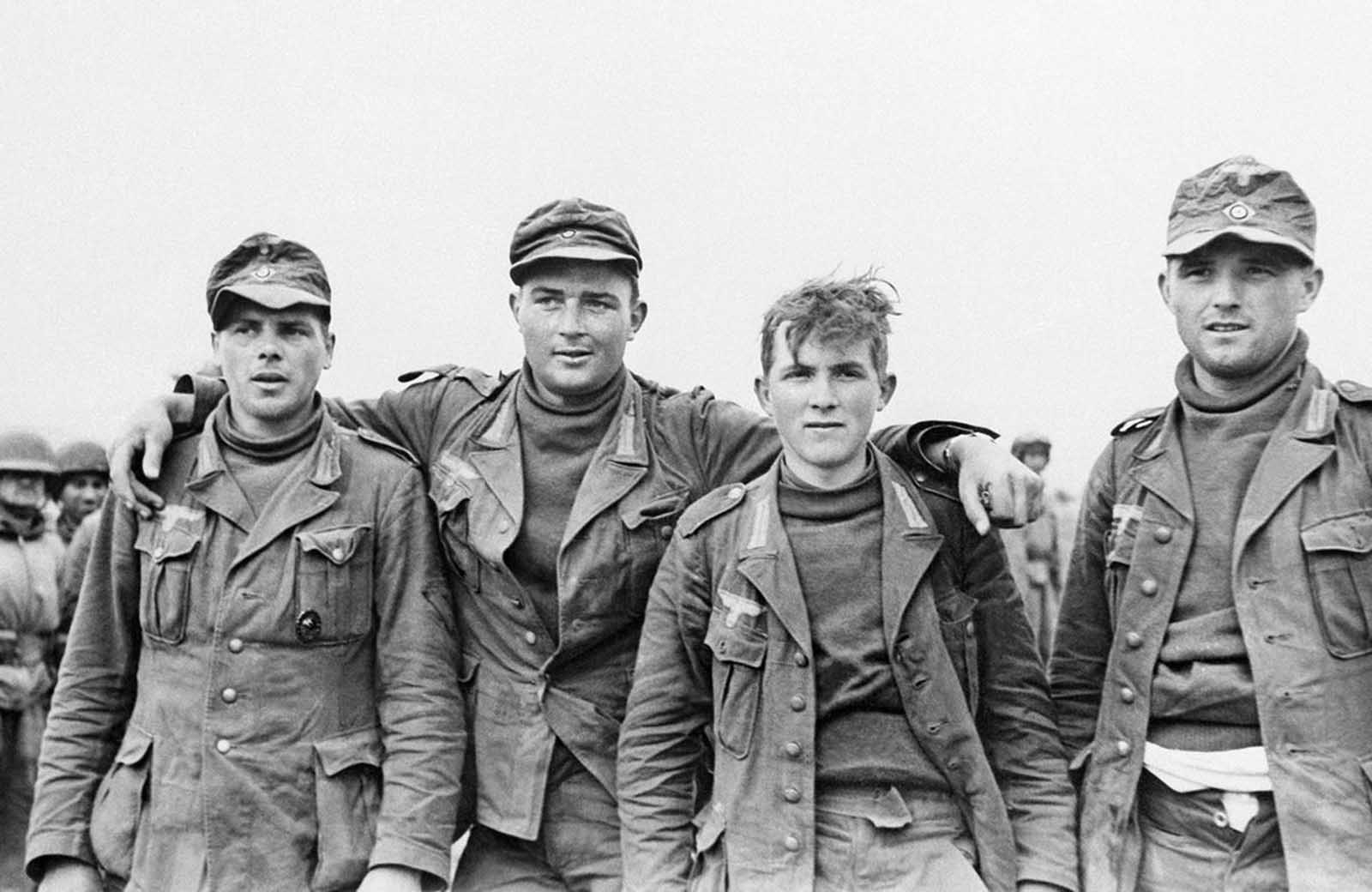 German prisoners captured during an Allied raid on German-Italian position in Sened, Tunisia on February 27, 1943. The hatless soldier stated that he was only twenty years old.