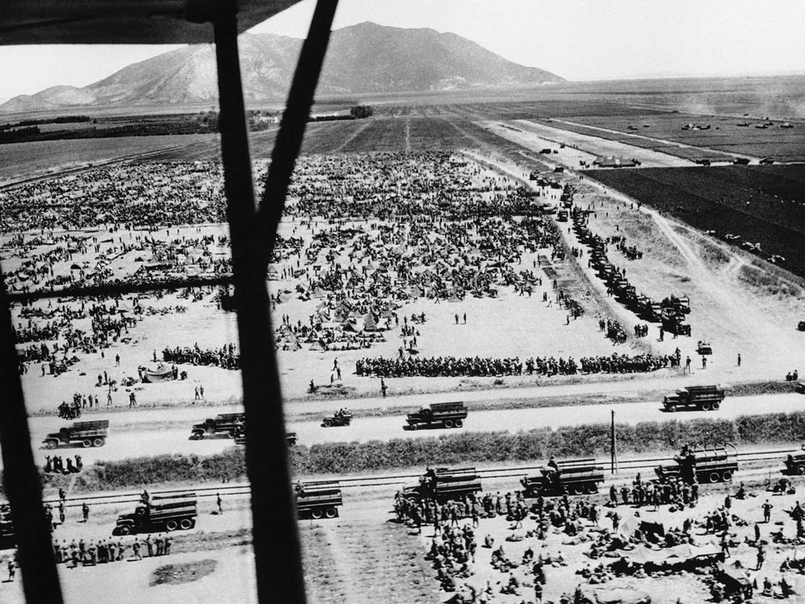 After the surrender of Axis forces in Tunisia in May of 1943, Allied forces took more than 275,000 prisoners of war. Shown here is one roundup of thousands of German and Italian soldiers in Tunisia seen in an Army Air Forces aerial shot, on June 11, 1943.