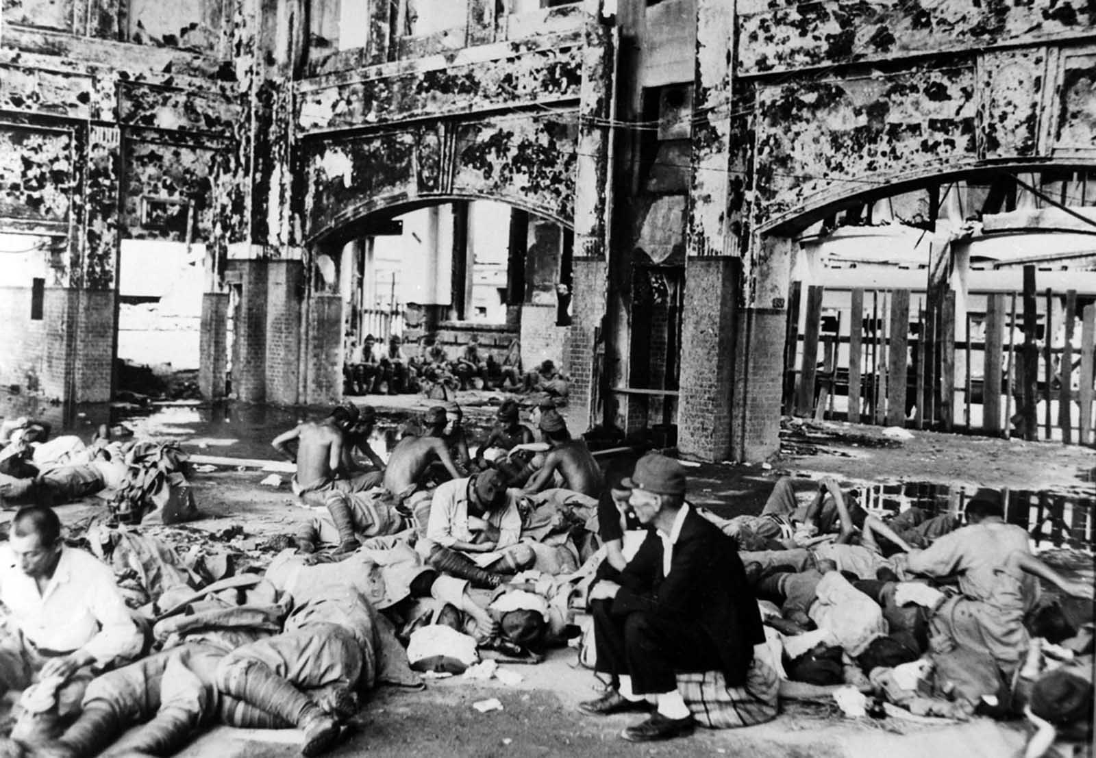 Japanese troops rest in the Hiroshima railway station after the atomic bomb explosion.