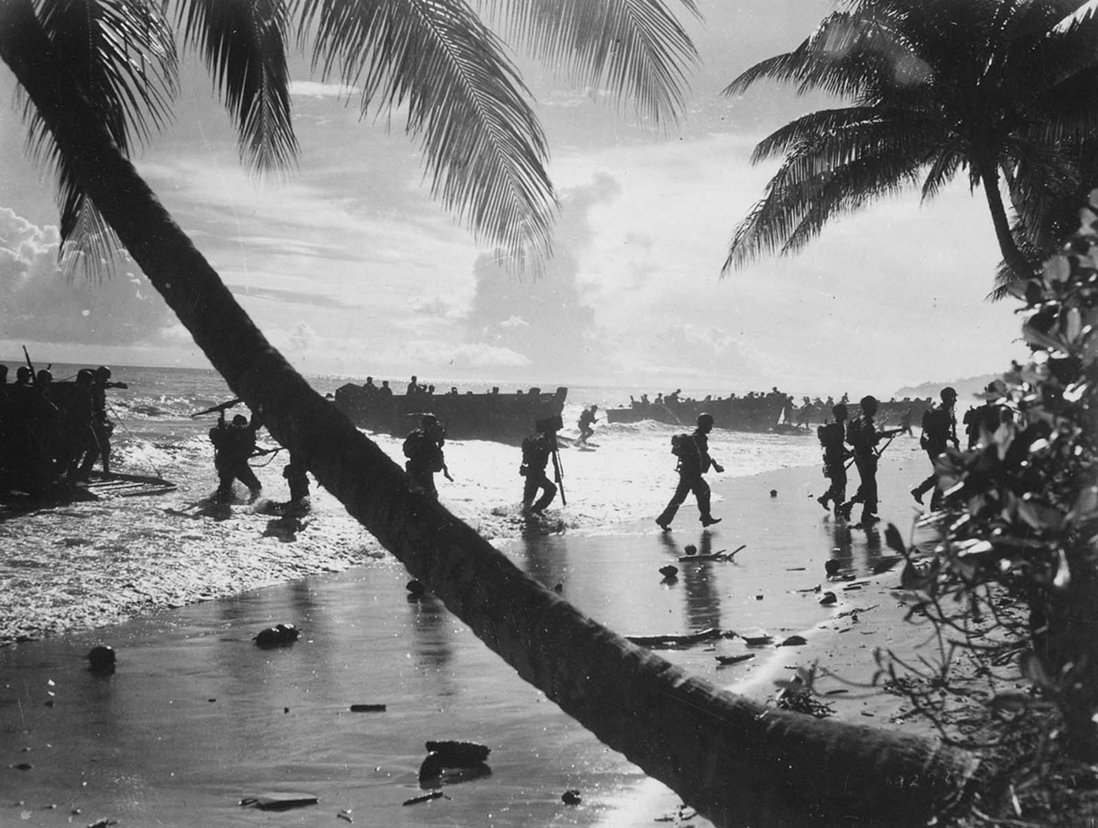 U.S. troops from the 160th Infantry Regiment are seen as they disembark from a landing craft during amphibious training on Guadalcanal, Solomon Islands, in August of 1942.