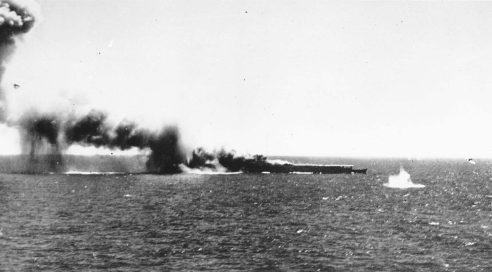 A Japanese aircraft carrier is bombed by a U.S. Navy plane in the Battle of the Coral Sea, in May of 1942. This was the first naval battle in history in which neither side's ships ever sighted or fired directly upon the other.
