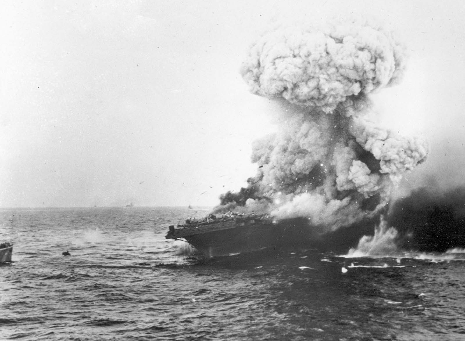 The USS Lexington explodes after being bombed by Japanese planes in the Battle of the Coral Sea in May of 1942. More than 200 of the carrier's 2,951-man crew went down with the ship. While Japanese forces won a tactical battle, a number of their damaged ships were unable to participate in the upcoming pivotal Battle of Midway, which took place one month later.