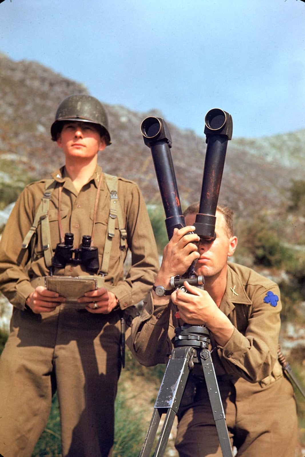 An American soldier tried to spot German positions during the Allied drive towards Rome, 1944.