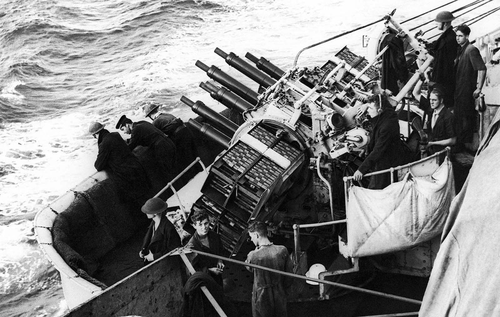 Warships of the British Mediterranean Fleet bombarded Fort Cupuzzo at Bardia, Libya, on June 21, 1940. On board one of the battleships was an official photographer who recorded pictures during the bombardment. Anti-aircraft pom-pom guns stand ready for action.