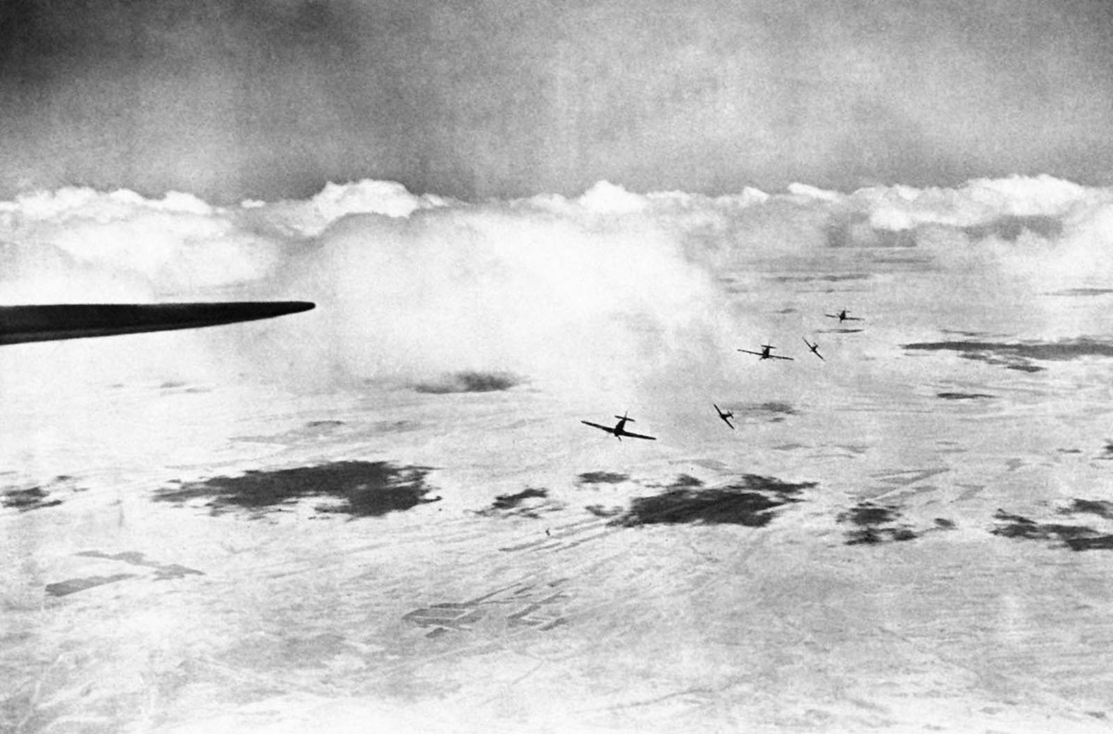 The moment a patrol of British Hurricane fighter planes, flying over a middle east sector, broke formation to attack enemy aircraft, on December 28, 1940.