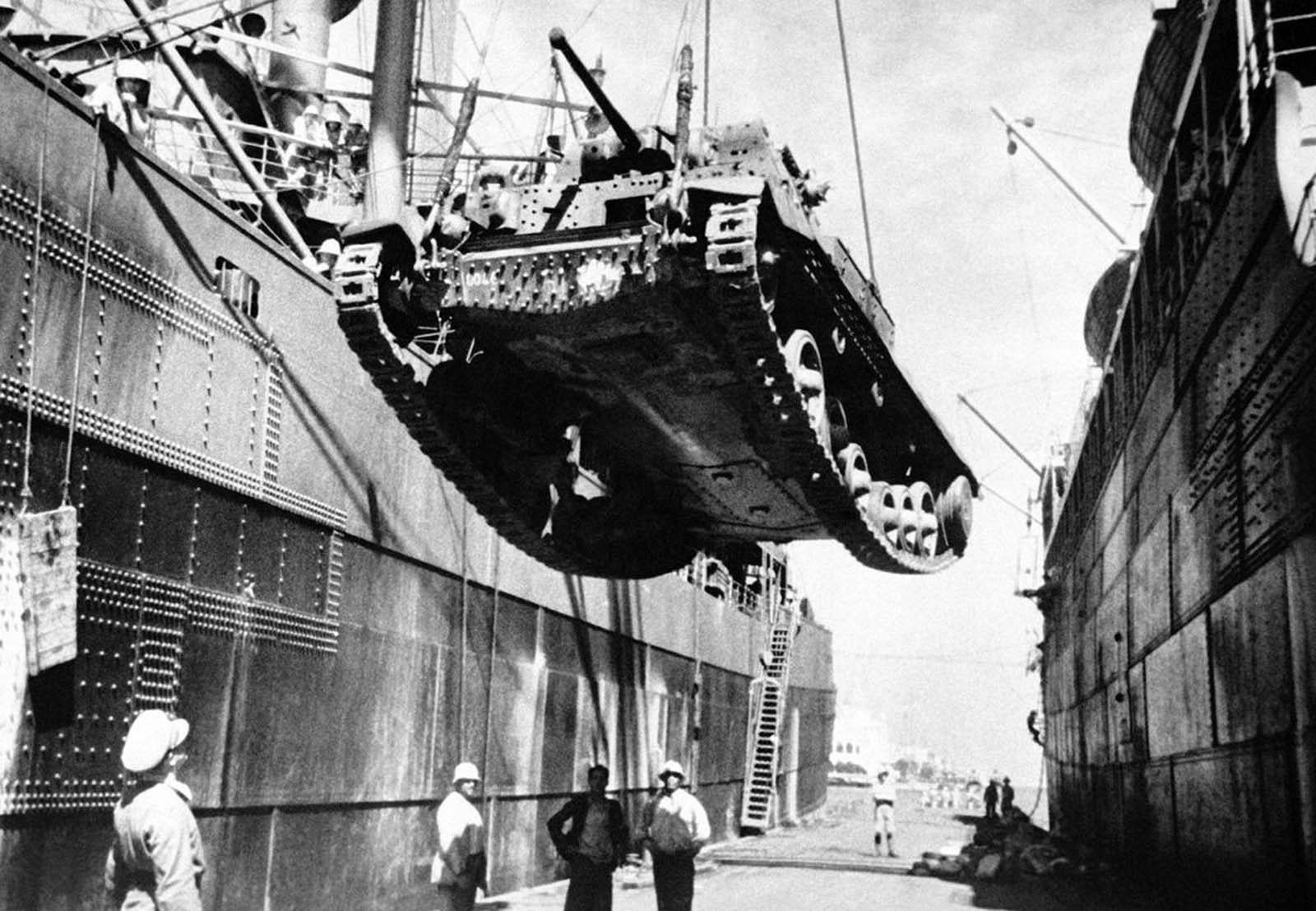 A British Cruiser tank is unloaded at a port in Egypt, on November 17, 1940. It is one of a large number which had just been shipped there by British forces.