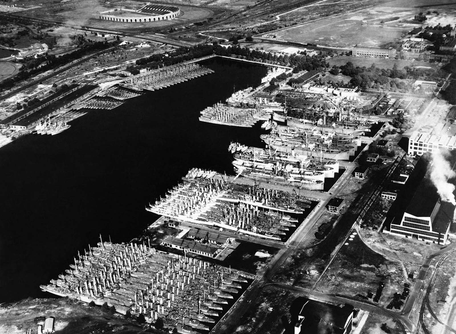 Outdated, but serviceable U.S. destroyers sit in the Back Bay at the Philadelphia Navy Yard, on August 28, 1940. Plans were well underway to bring these ships up to date and transfer them to Allied countries to aid their defense. These programs would be signed into law as the Lend-Lease program in March of 1941, and would result in billions of dollars worth of war material being shipped overseas.