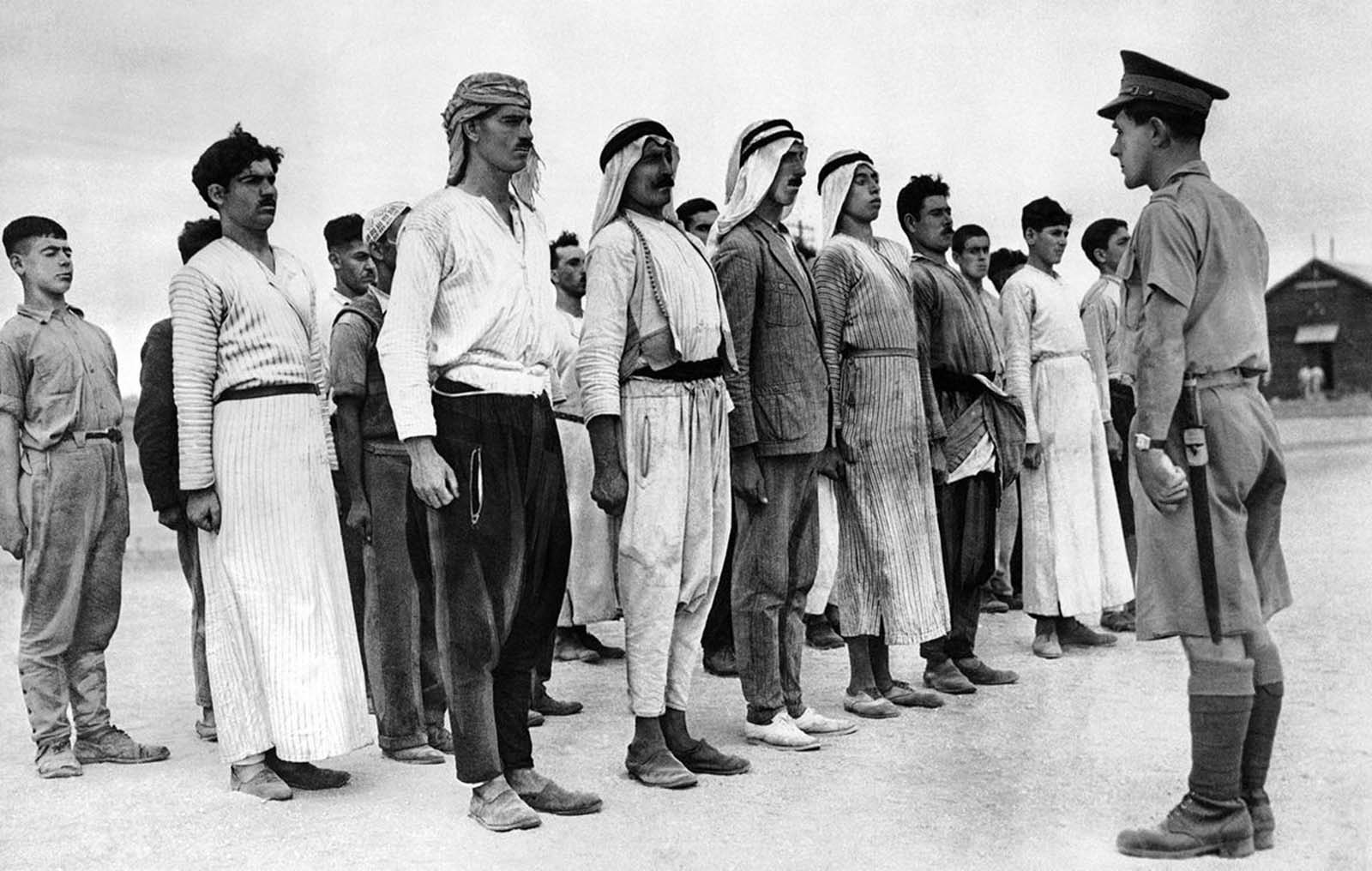 These Arab recruits line up in a barracks square in the British Mandate of Palestine, on December 28, 1940, for their first drill under a British solider. Some 6,000 Palestinian Arabs signed up with the British Army during the course of World War II.