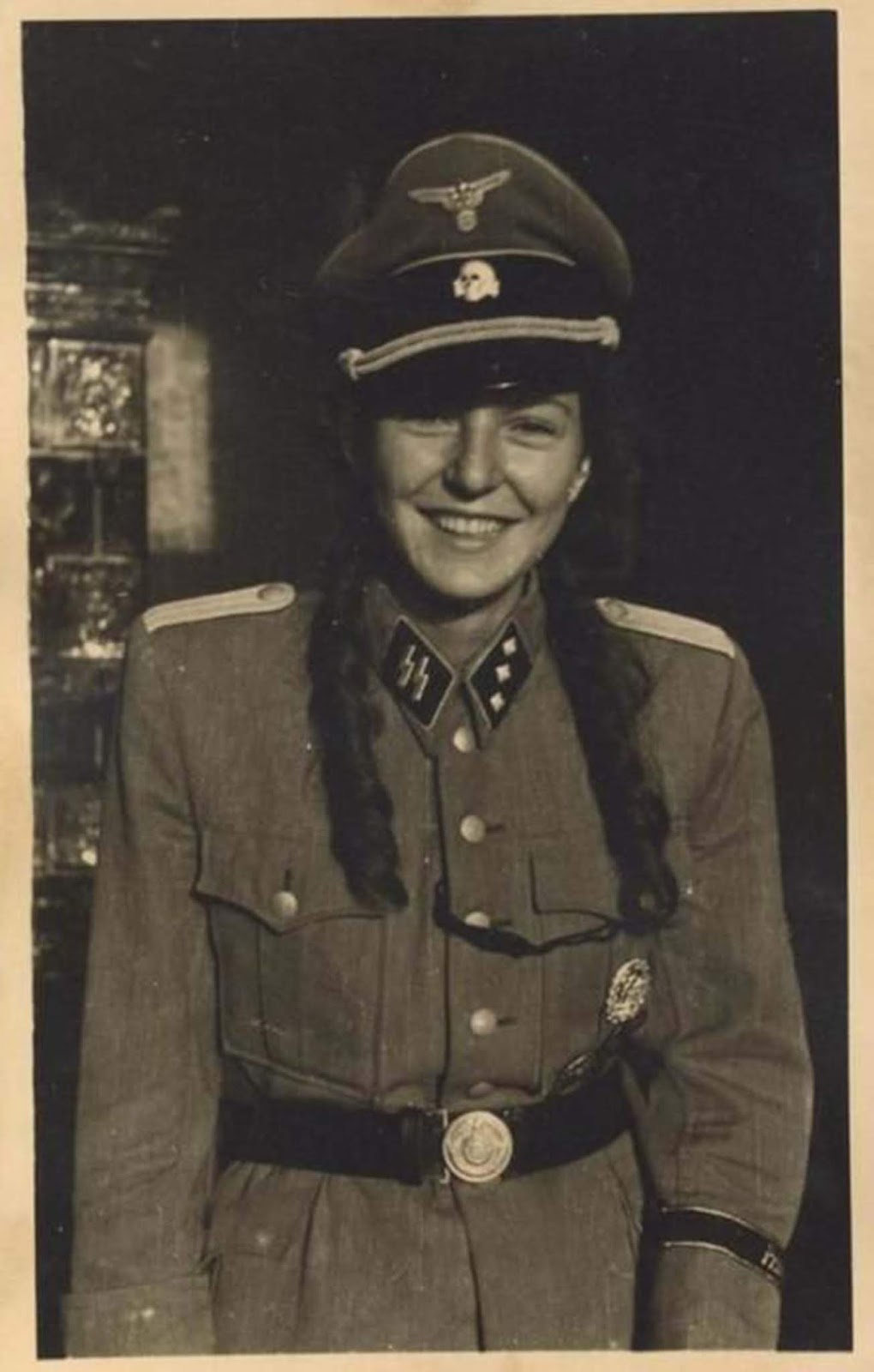 A French girl wearing y she's wearing what appears to be a very authentic SS uniform. Read more on this article: Sleeping with the enemy: Collaborator girls of the German-occupied Europe.