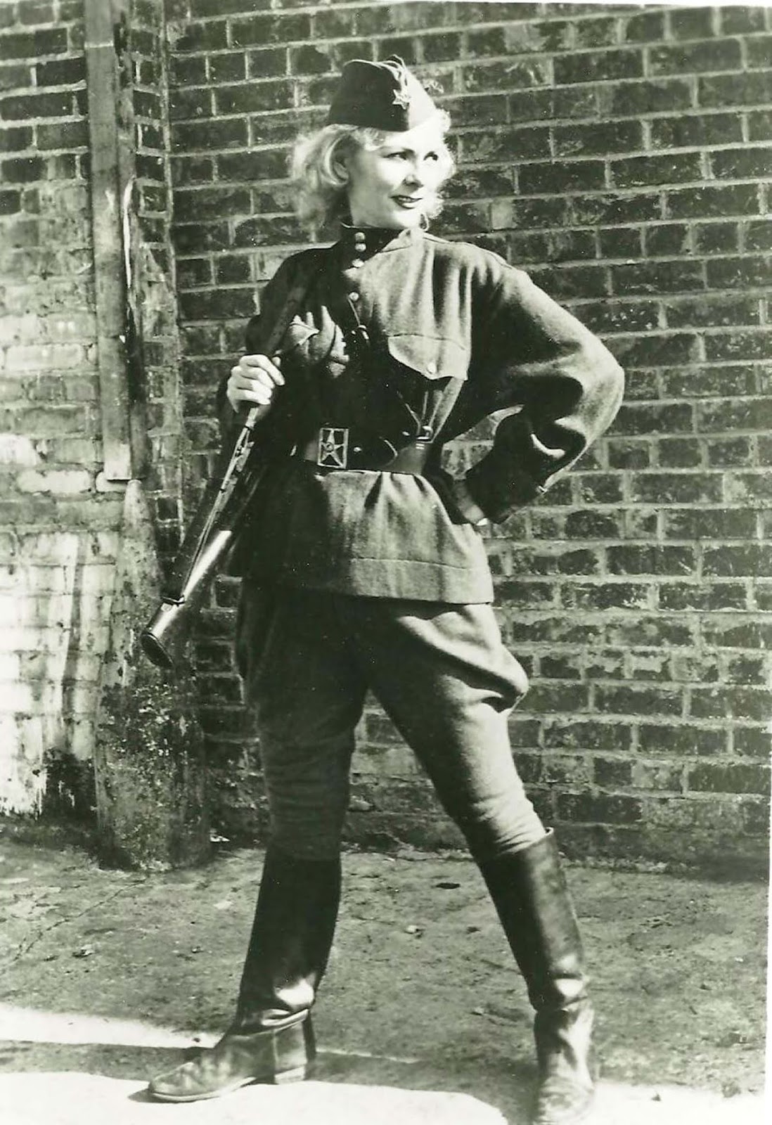 Kyra Petrovskaya was a World War II sniper. She kind of looks like Supergirl in this shot. Tough lady. If you're curious, read more about 