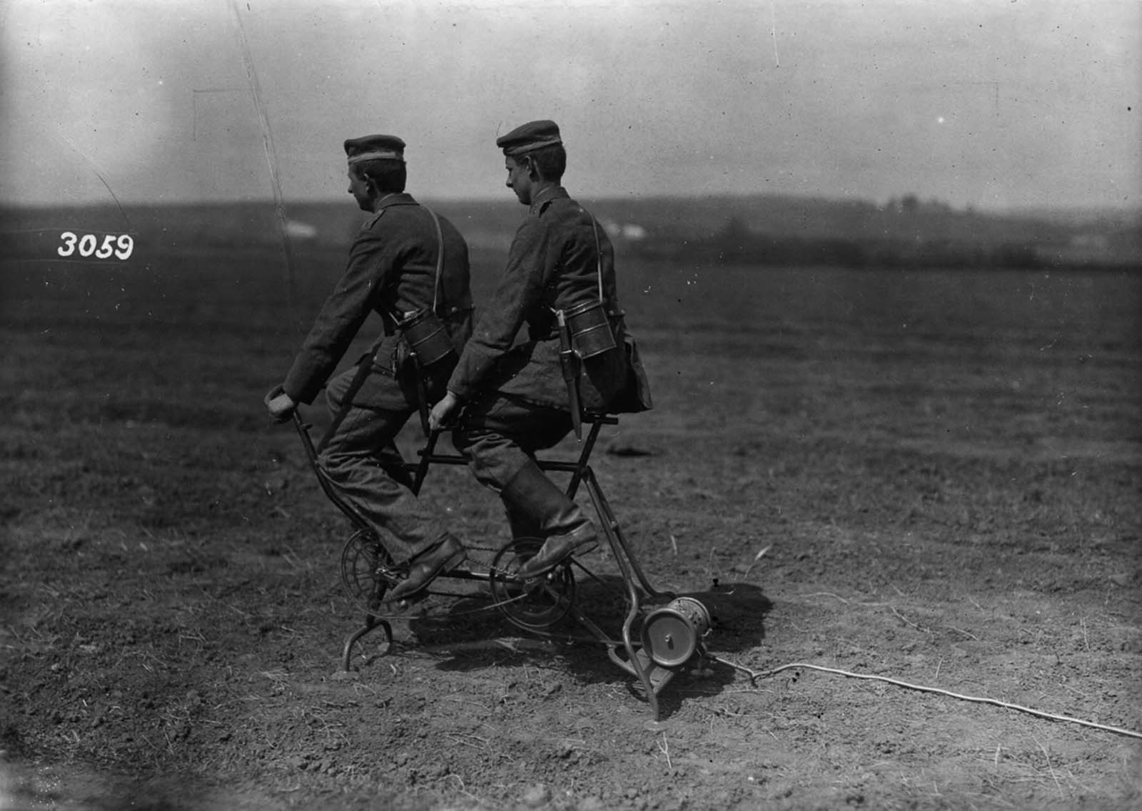 German soldiers generate power to inflate an observation balloon. 1914.