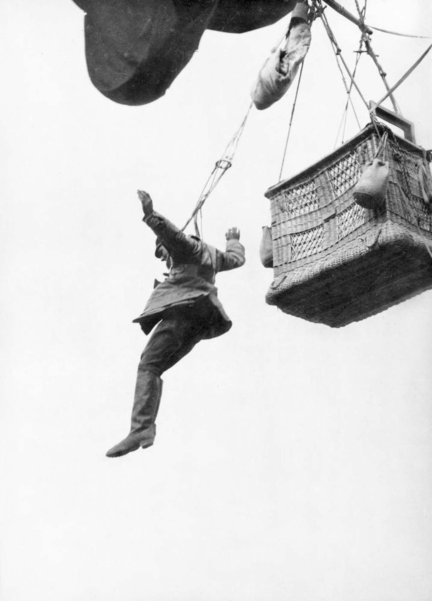 A German observer leaps from his balloon with a parachute. 1916.