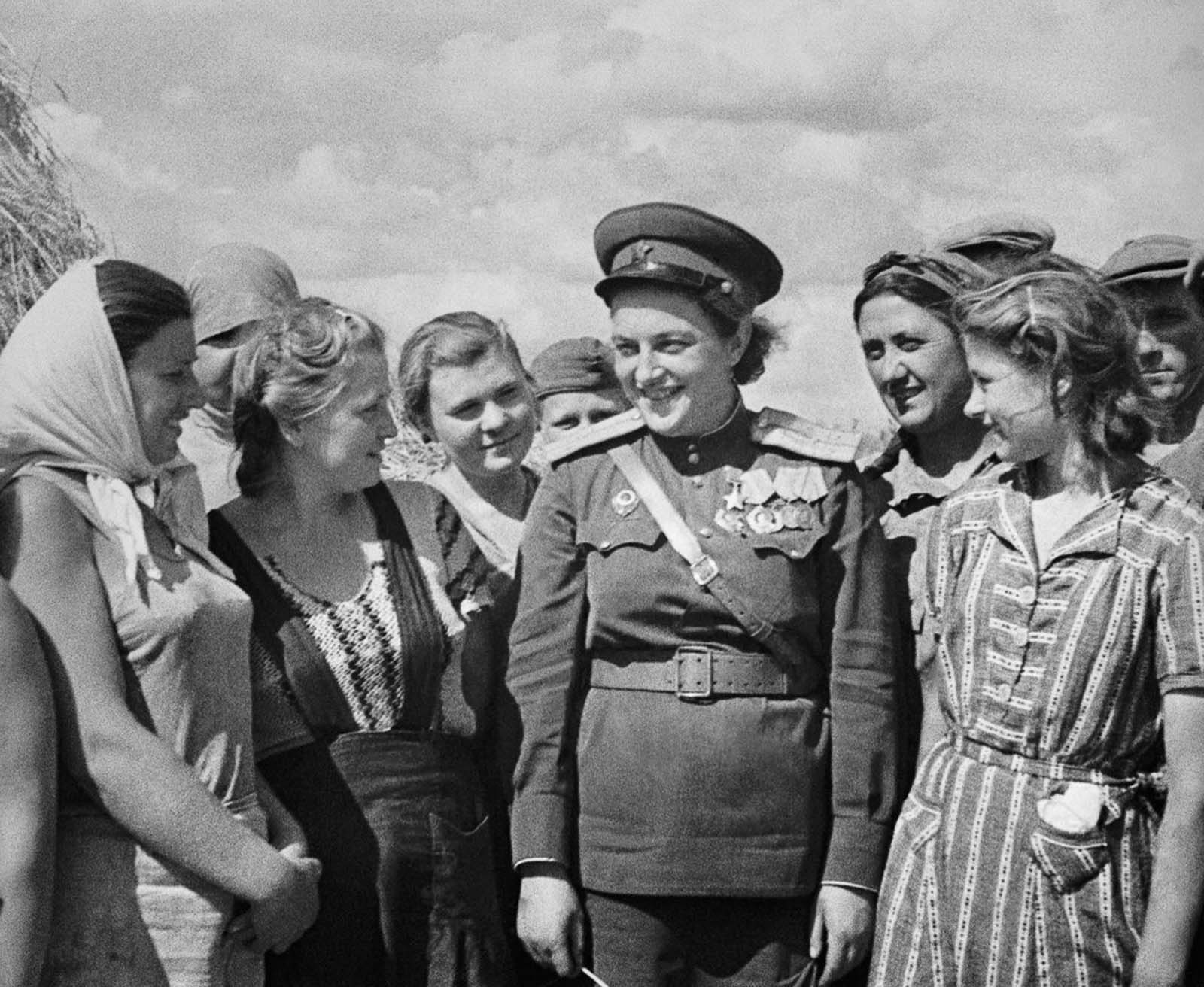 Pavlichenko visits workers near Odessa. 1944.