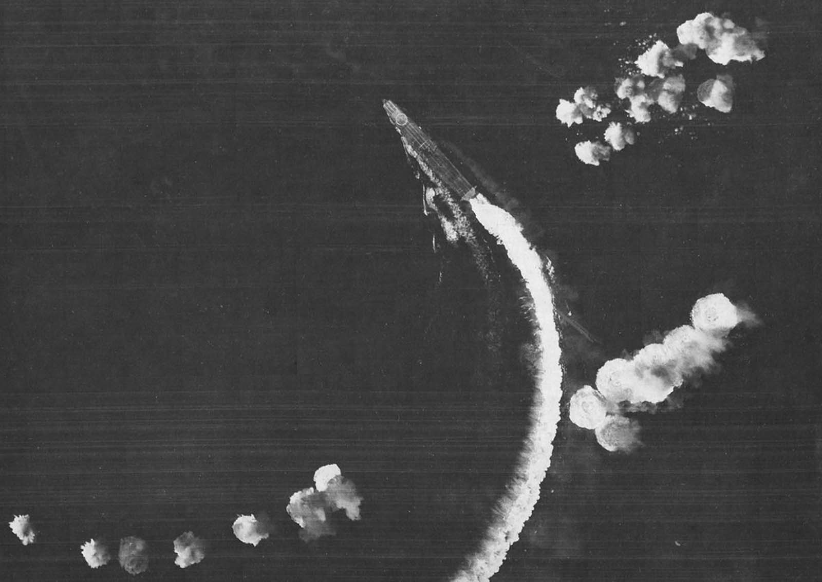 The Japanese carrier Hiryu maneuvers to avoid bombs dropped by Army Air Forces B-17 Flying Fortresses during the Battle of Midway, on June 4, 1942.