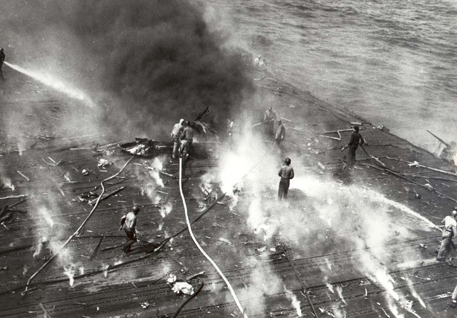 Black smoke pours from the aircraft carrier Yorktown after she suffered hits from Japanese aircraft during the Battle of Midway, on June 4, 1942.