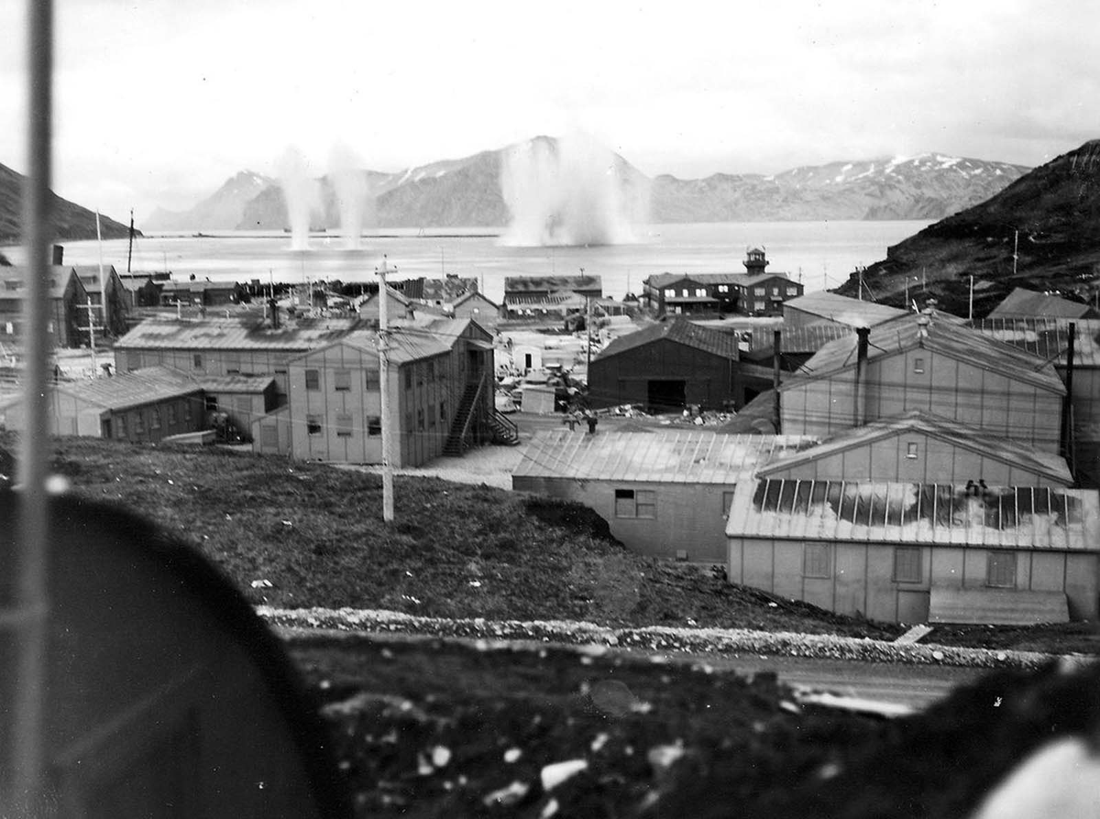 On June 3, 1942, a Japanese aircraft carrier strike force launched air attacks over two days against the Dutch Harbor Naval Base and Fort Mears in Dutch Harbor, Alaska. In this photo, bombs explode in the water near Dutch Harbor, during the attack on June 4, 1942.