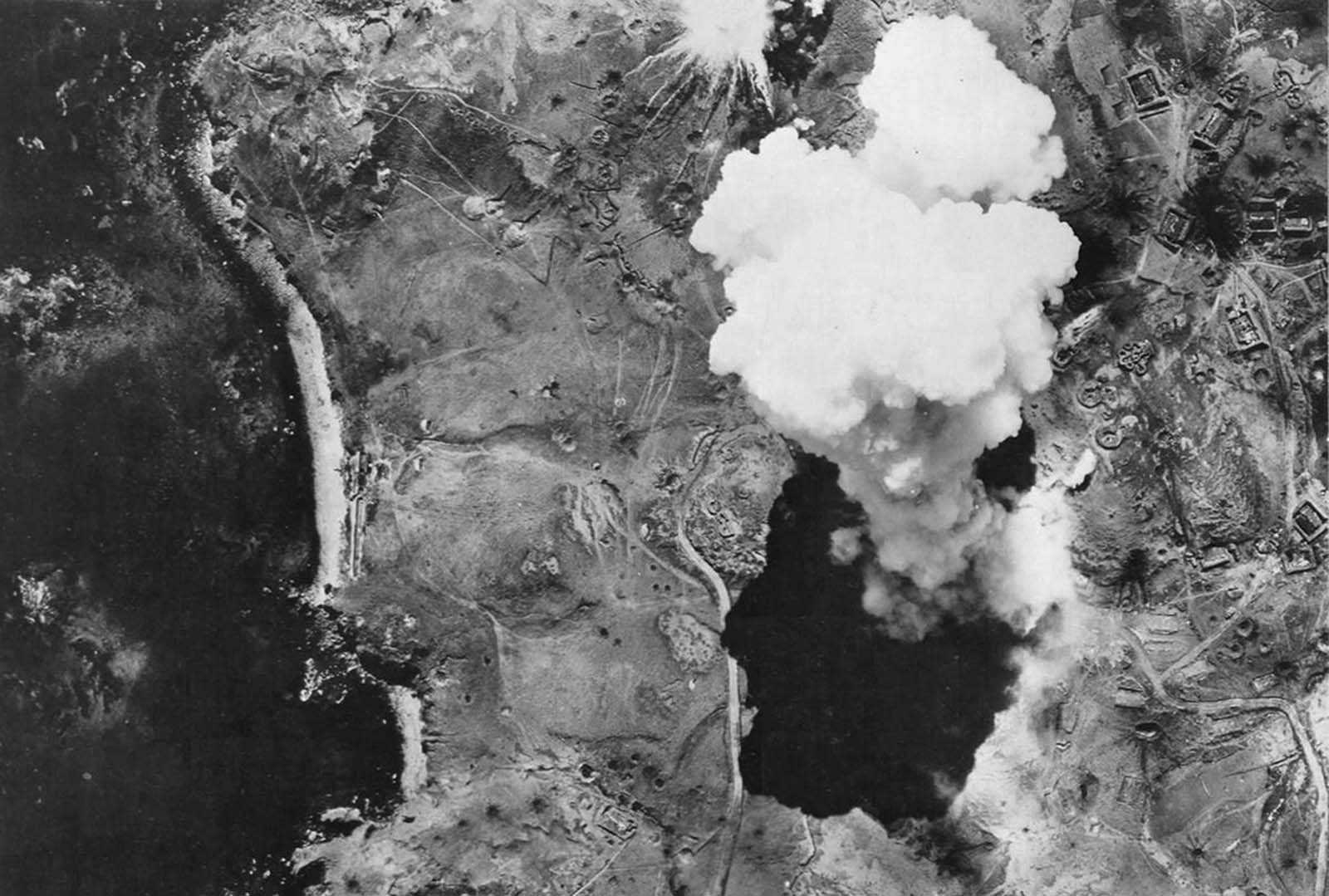 Bombs dropped from a U.S. bomber detonate on Japanese-occupied Kiska Island, Alaska, on August 10, 1943.