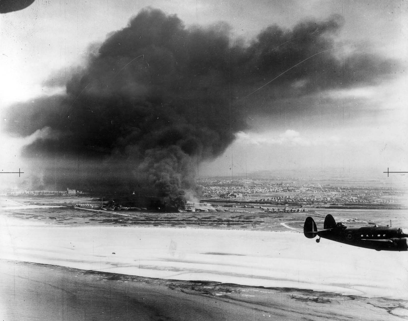 Oil tanks burn on Dunkirk beach.