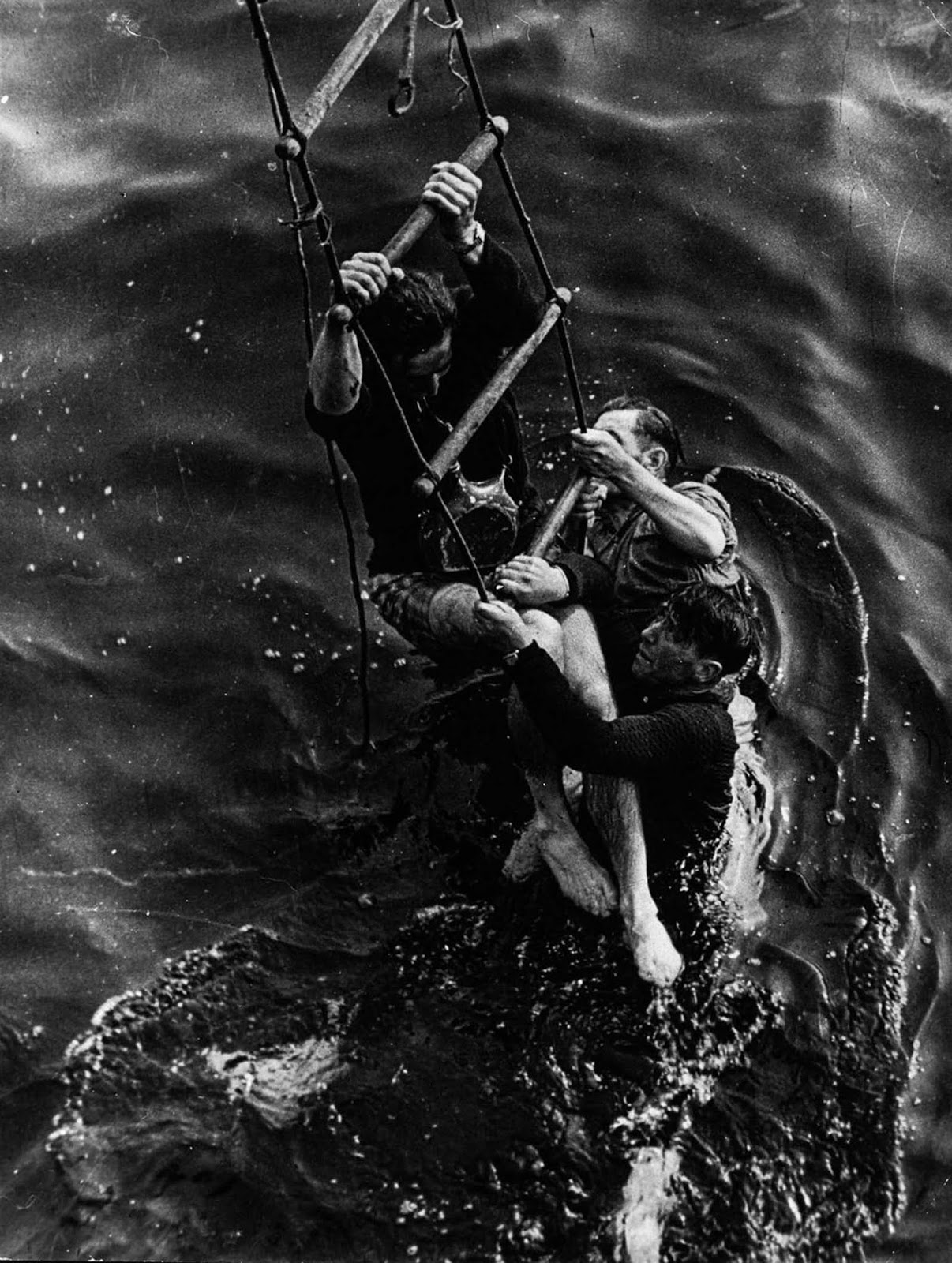 Allied soldiers climb aboard a ship during the evacuation of Dunkirk.