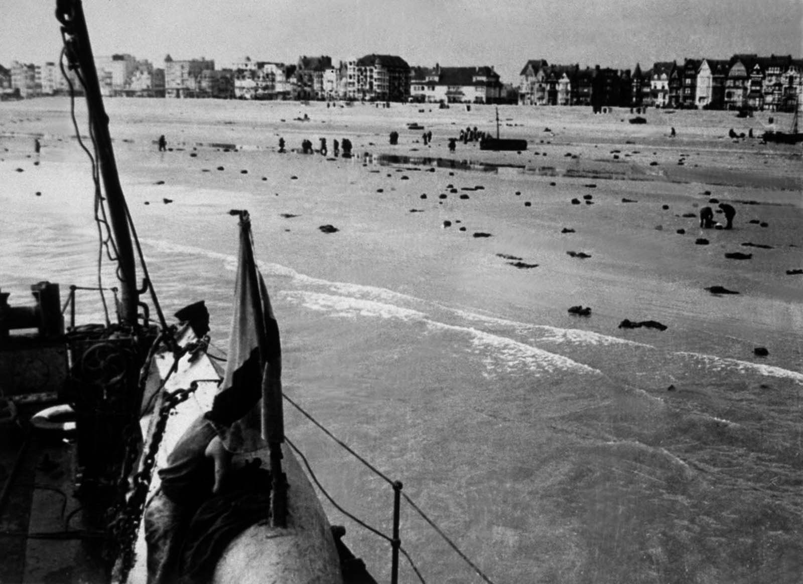 Discarded coats and equipment litter the beach at Dunkirk.