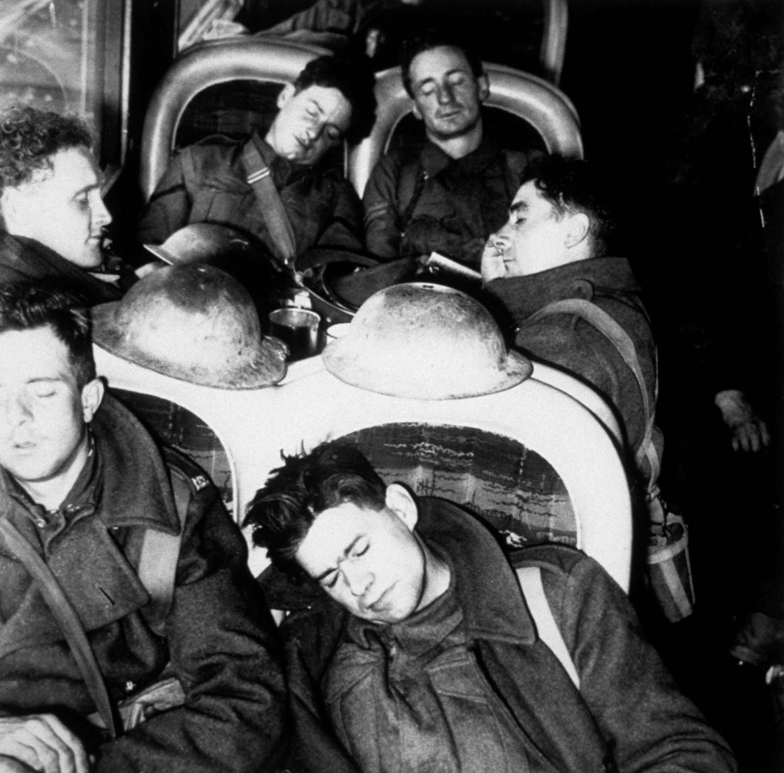 British soldiers sleep aboard a train after escaping from Dunkirk.