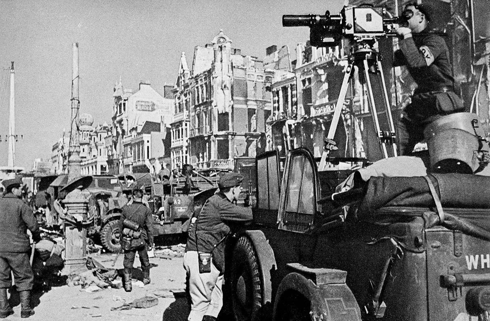 A German cameraman records the departure of the last Allied troops from Dunkirk.