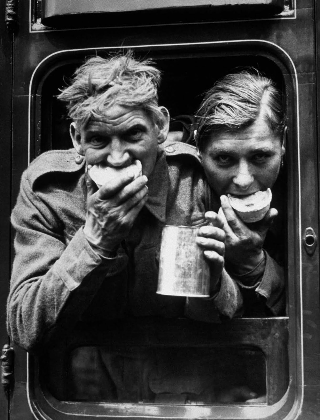 Allied soldiers enjoy food and drink upon returning to Britain.