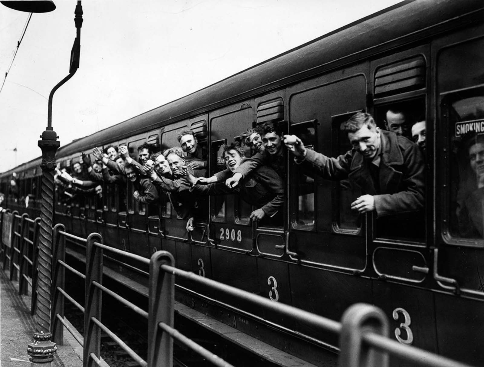 A trainload of British Expeditionary Force soldiers arrives back in London.