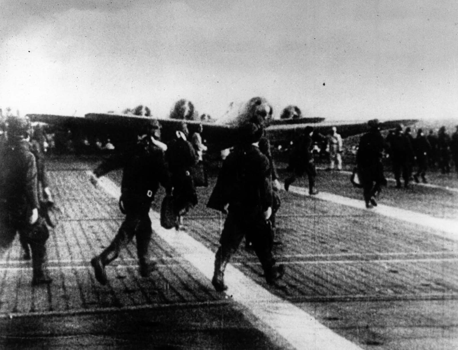 Pilots head for their aircraft.