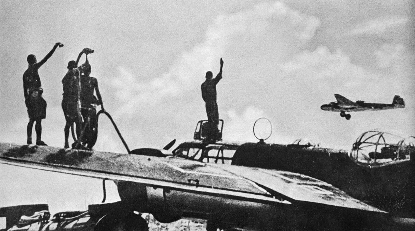 Japanese planes take off from a carrier to join the attack.