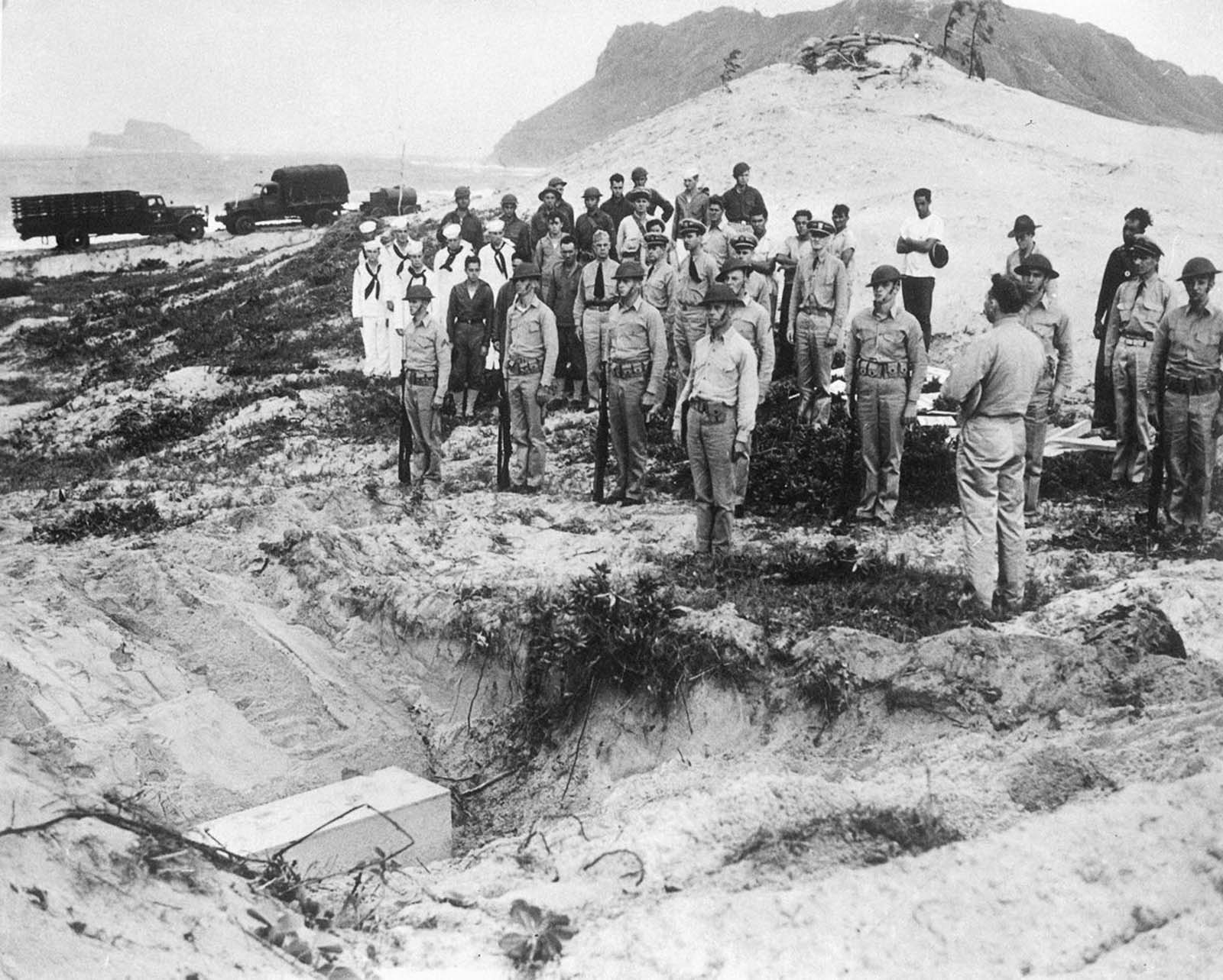 American troops bury the body a crashed Japanese lieutenant with military honors.