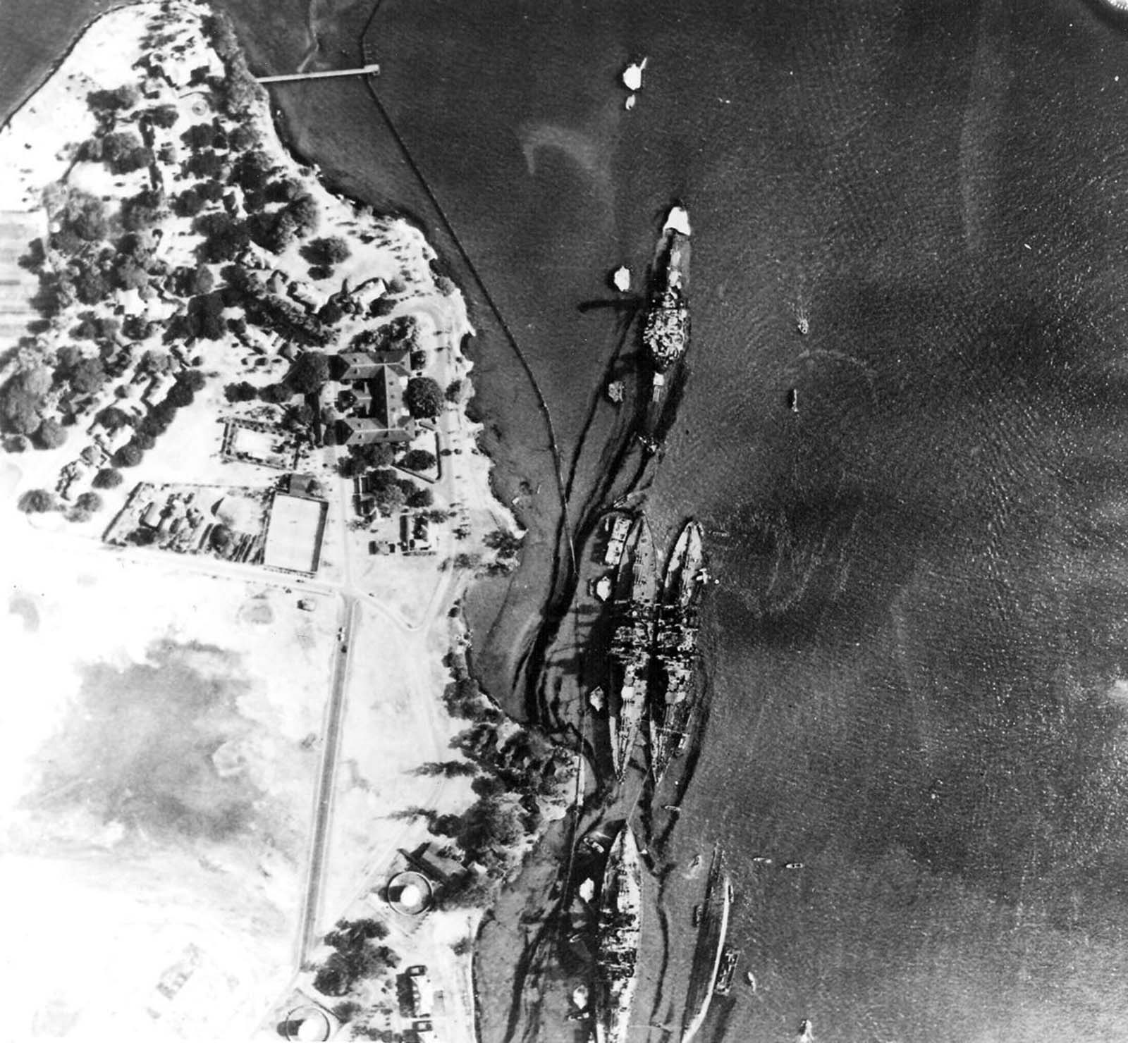 Oil leaks from damaged ships on Battleship Row.