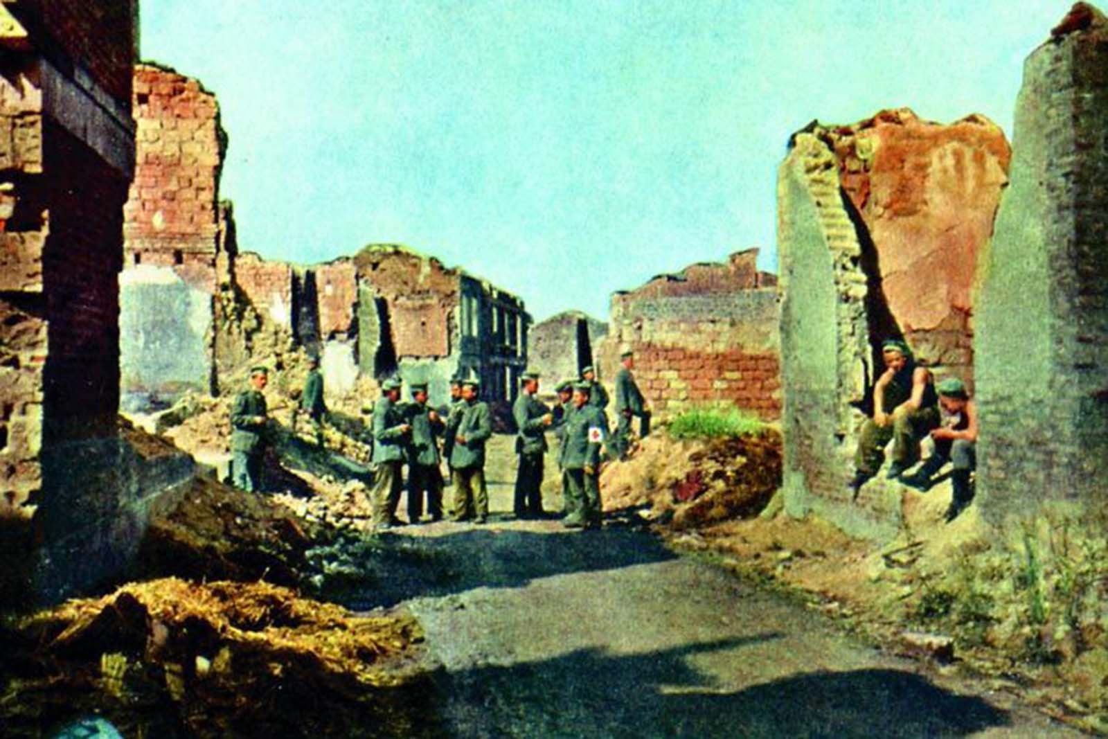 A group of German soliders stand in the ruins of Sommepy, a French village on the river Marne.