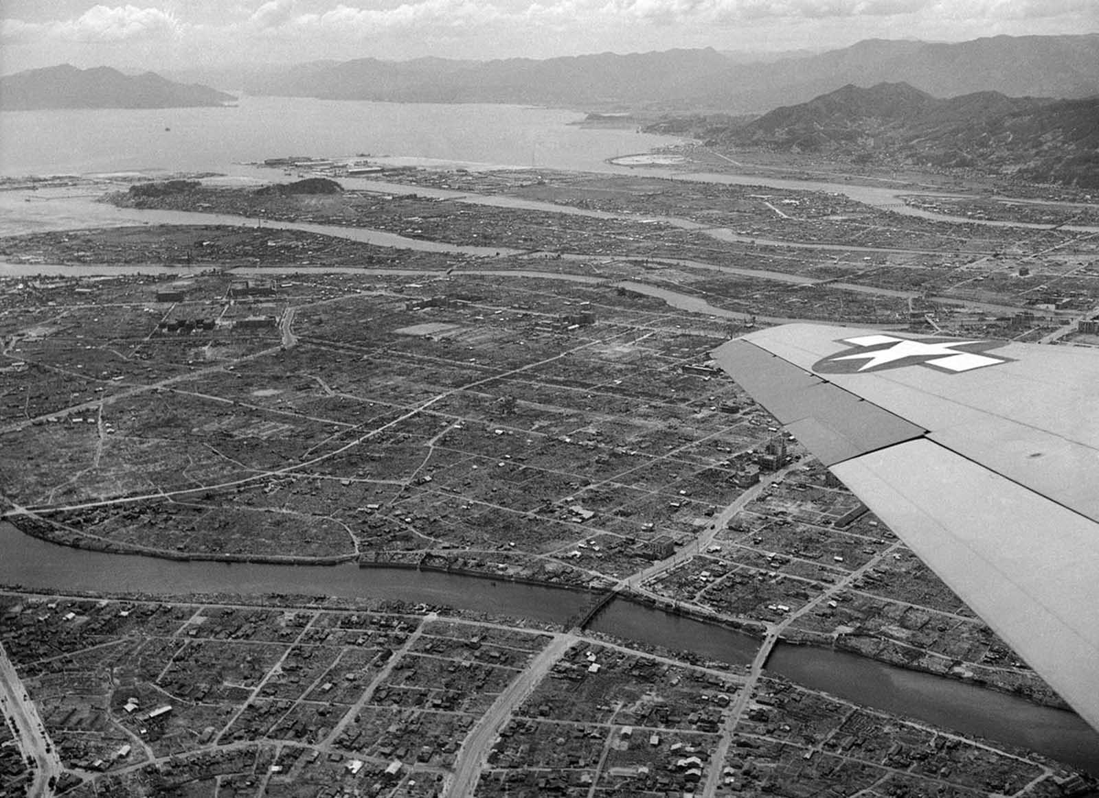 Aerial view of Hiroshima, Japan, one year after the atomic bomb blast shows some small amount of reconstruction amid much ruin on July 20, 1946. The slow pace of rebuilding is attributed to a shortage of building equipment and materials.