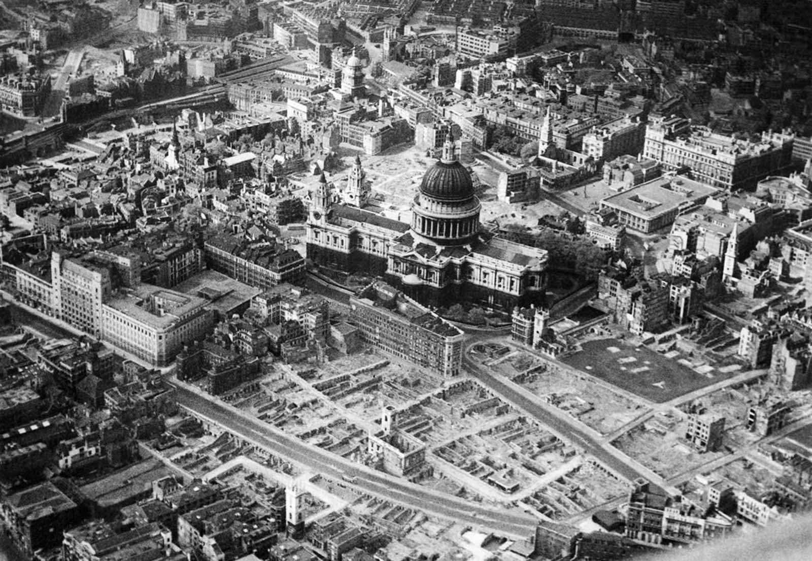 This is an aerial view of the city of London around St. Paul's Cathedral showing bomb-damaged areas in April of 1945.