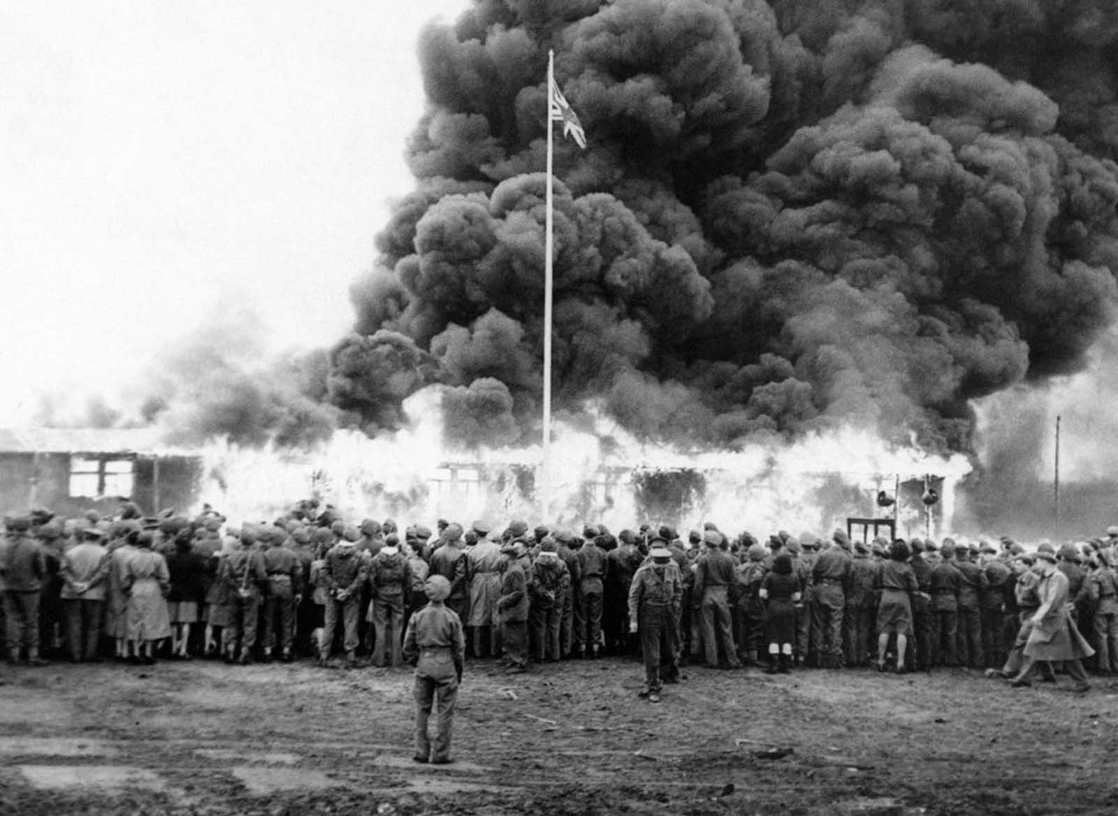 On May 21, Colonel Bird, Commandant of Belsen Camp, gave the order for the last hut at Belsen Concentration Camp to be burned. A rifle salute was fired in honor of the dead, the British flag was run up at the same moment as a flame-thrower set fire to the last hut. A German flag and portrait of Hitler went up in flames inside the hut in June of 1945.
