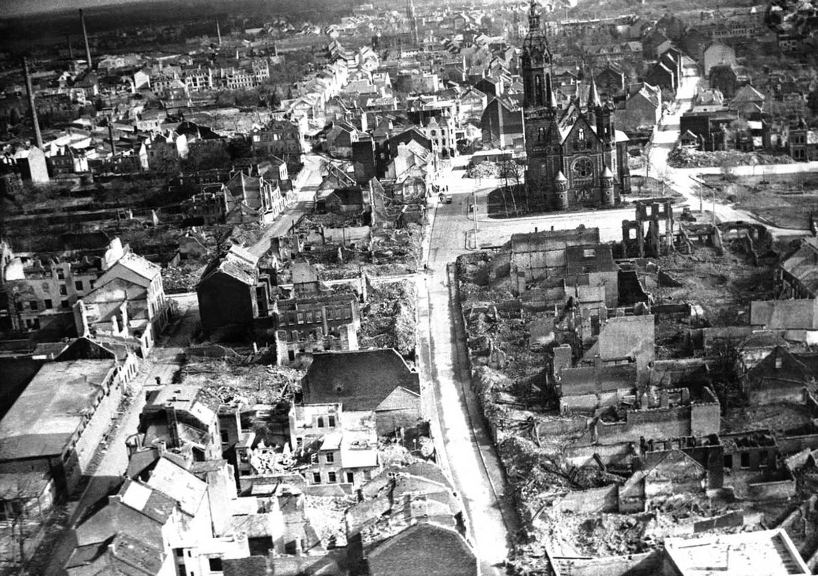 In Europe, some churches have been completely ruined, but others still stand amid utter devastation. Munchengladbach Cathedral stands here in the rubble, though still in need of repairs, seen in Germany, on November 20, 1945.