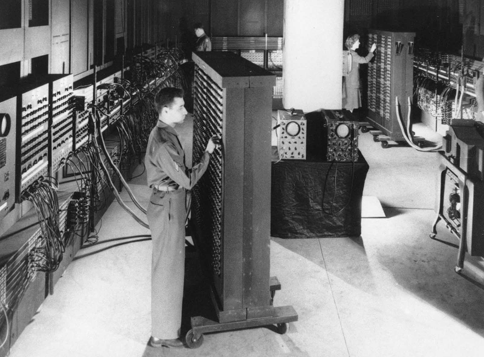 This 1946 photograph shows ENIAC (Electronic Numerical Integrator And Computer), the first general purpose electronic computer - a 30-ton machine housed at the University of Pennsylvania. Developed in secret starting in 1943, ENIAC was designed to calculate artillery firing tables for the United States Army's Ballistic Research Laboratory. The completed machine was announced to the public on February 14, 1946. The inventors of ENIAC promoted the spread of the new technologies through a series of influential lectures on the construction of electronic digital computers at the University of Pennsylvania in 1946, known as the Moore School Lectures.