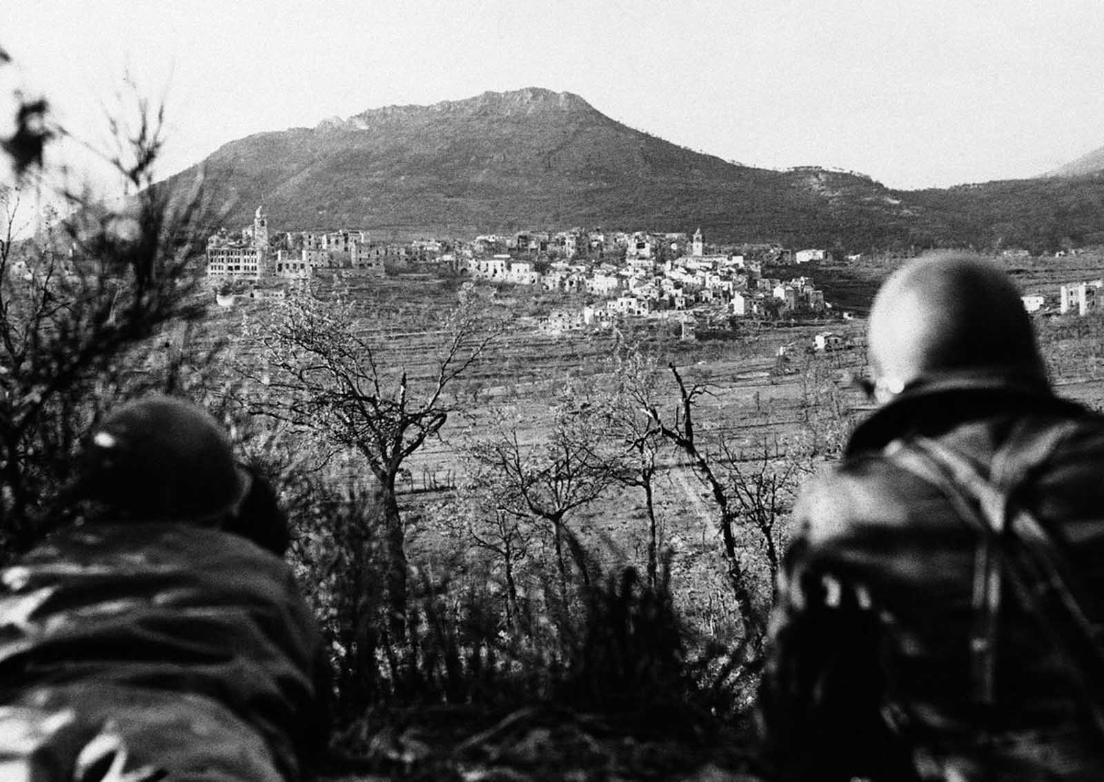 Artillery observers of the Fifth Army look over the German-held Italian town of San Vittore, on November 1, 1943, before an artillery barrage to dislodge the Germans.