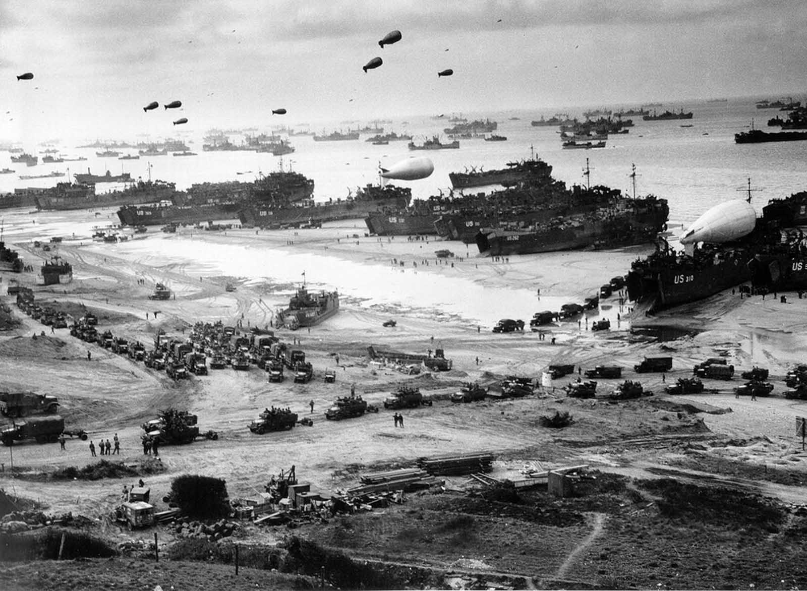 Allied troops unload equipment and supplies on Omaha Beach in Normandy, France, in early June of 1944.