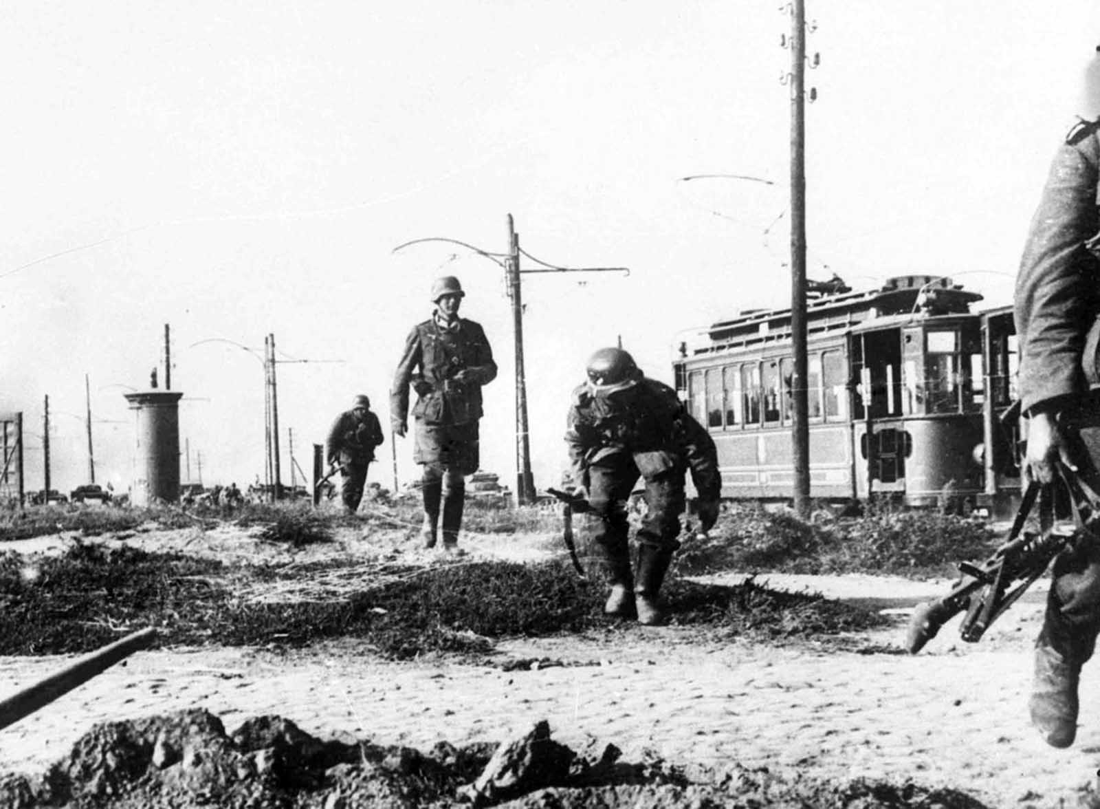 German infantry cautiously advance on the outskirts of Warsaw, Poland on September 16, 1939.