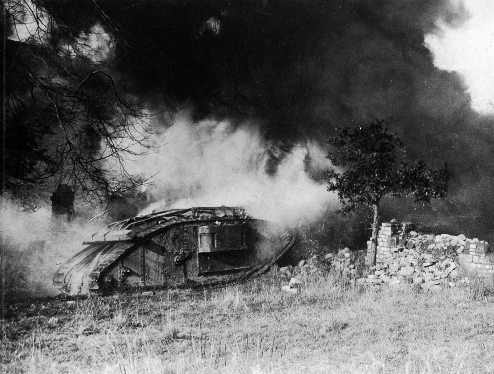 A British tank burns after being hit by a flamethrower. 1918.