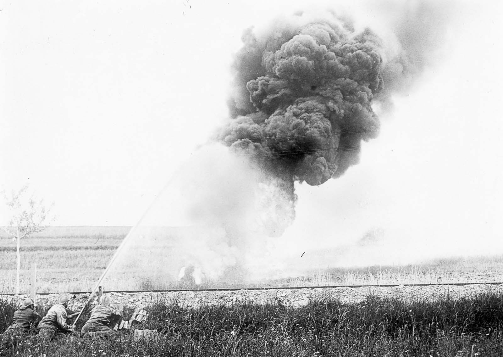 French forces use a flamethrower against German forces. 1915.