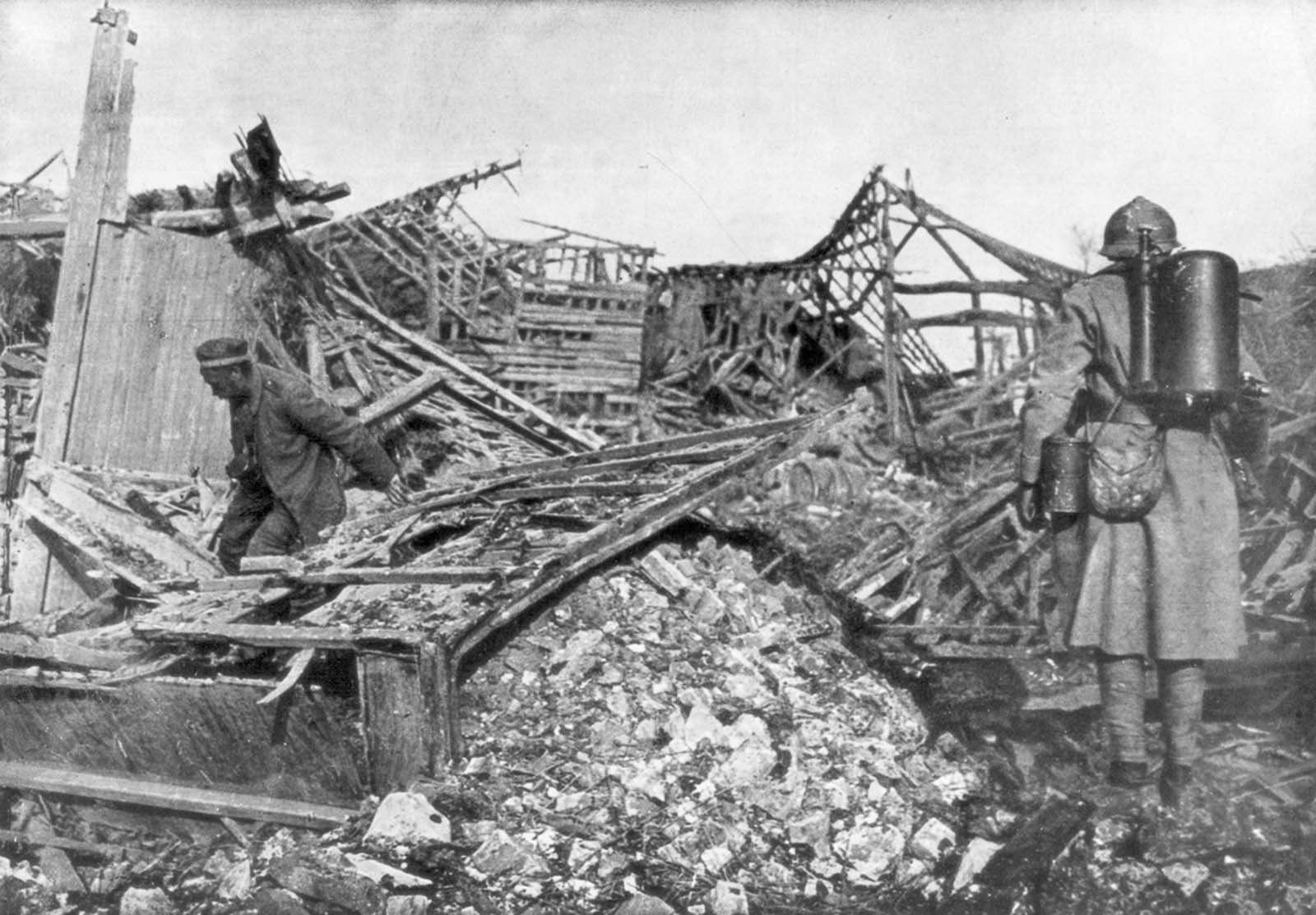 French troops use flamethrowers to flush out German positions in the town of Cantigny, France. 1918.