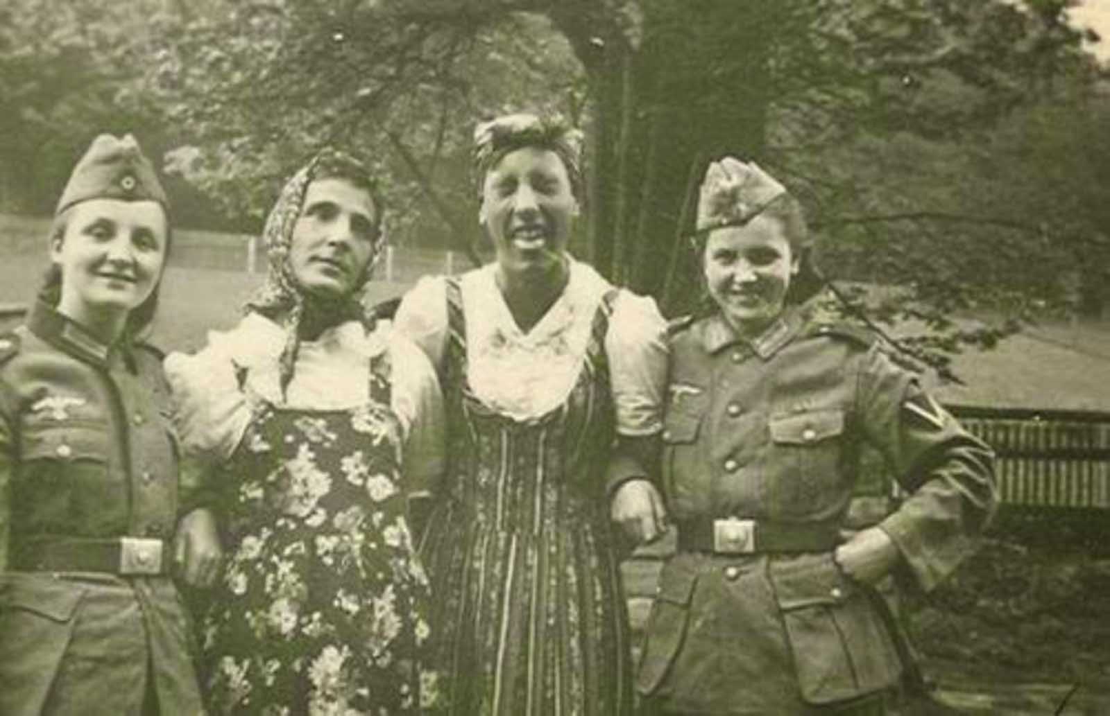 German soldiers exchanging their clothes with their girlfriends. Those uniforms really fit those women pretty well!