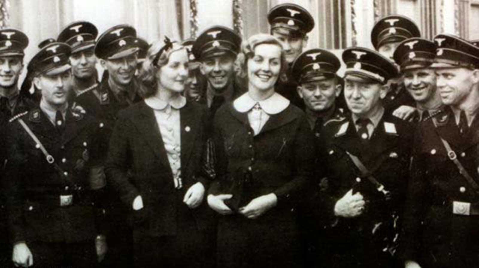 Unity Mitford (L) and her sister Lady Diana Mosley, nee Mitford (R) with SS troops at the September 1937 Nuremberg Party rally. The sisters were familiar faces in pre-war Germany.